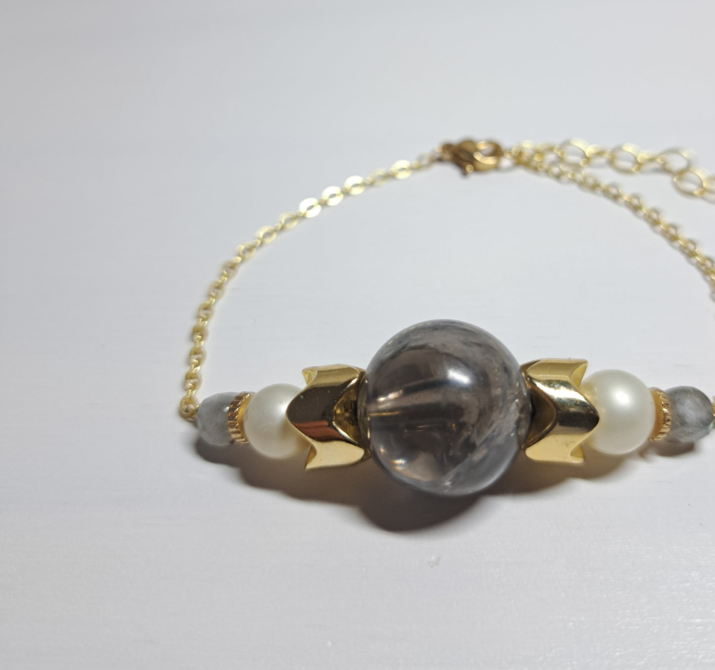 Second-hand gray and gold bracelet