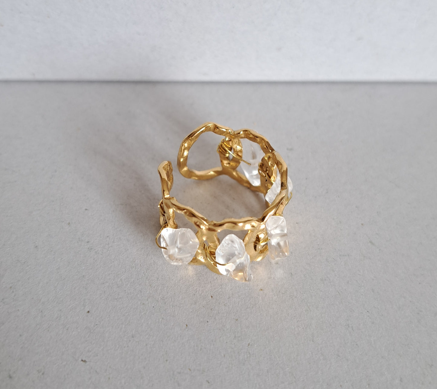 Textured and rock crystal ring