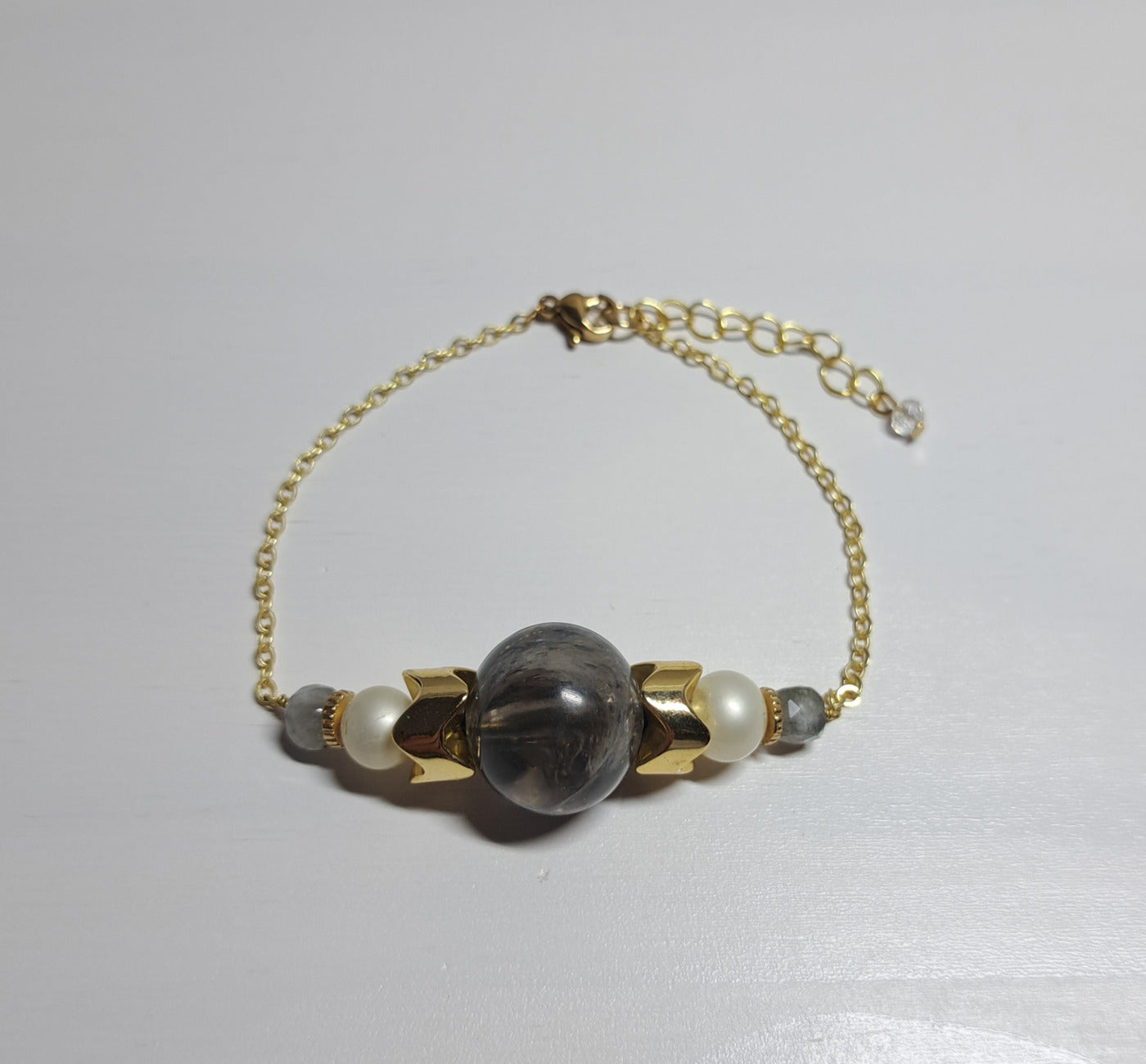 Second-hand gray and gold bracelet