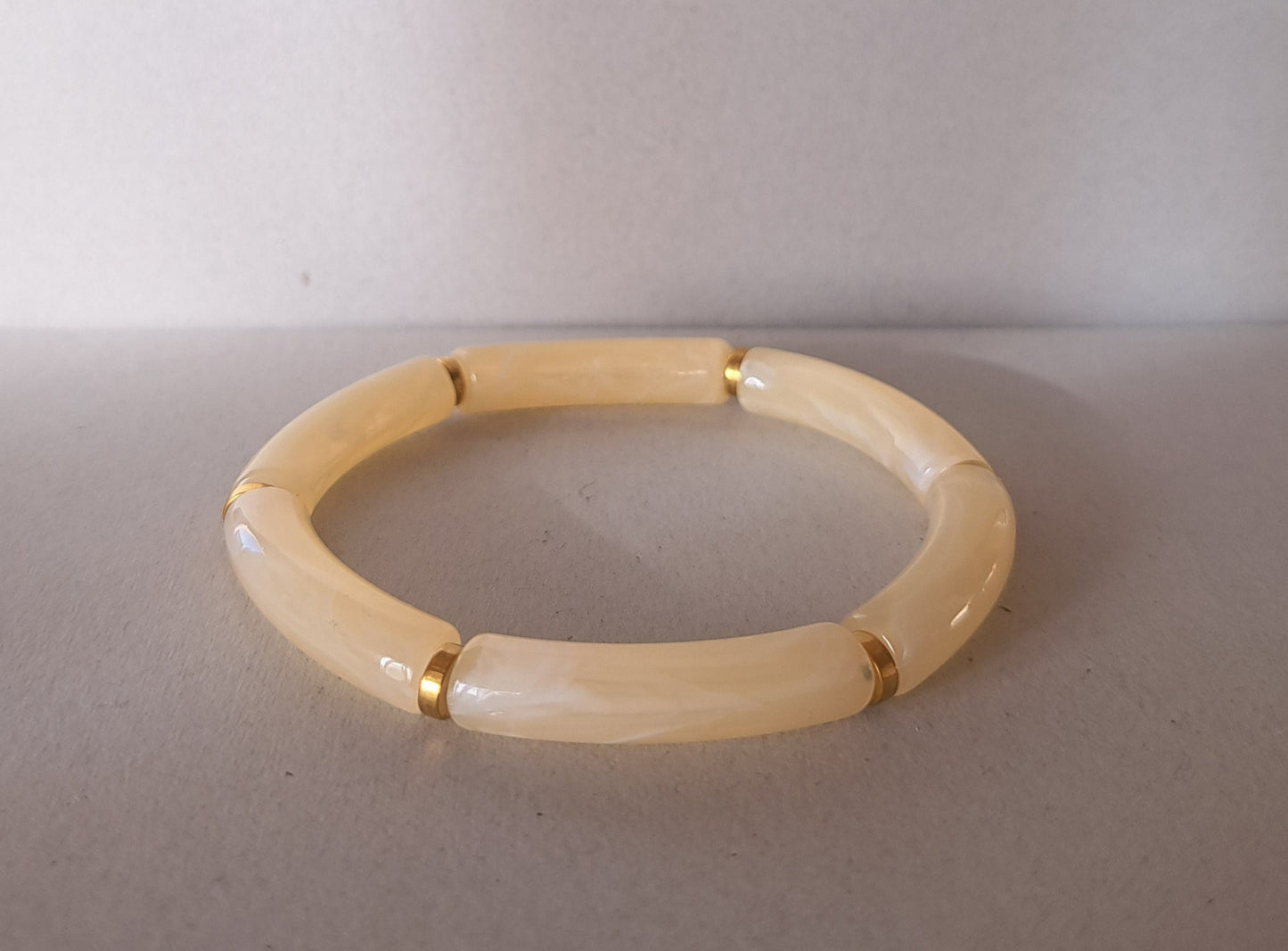 Ecru and gold resin bracelet